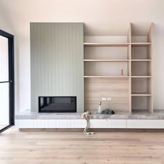 a living room filled with lots of furniture and a tv on top of a wooden shelf