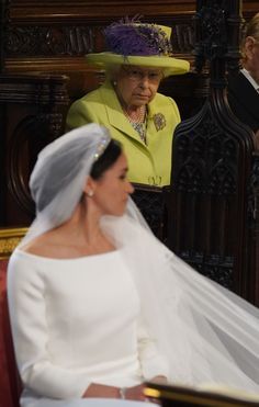 the bride and groom are sitting down for their wedding ceremony at westminster palace in london, england