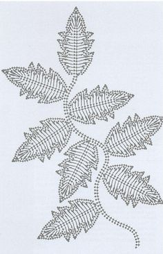 a cross stitch pattern with leaves on white fabric, which has been drawn in the shape of a leaf