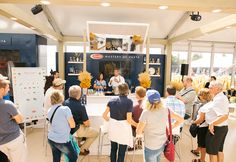 a group of people standing in front of a counter