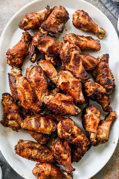 grilled chicken wings on a white plate