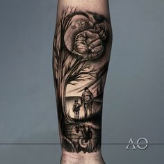 a man's leg with a black and white tattoo design on it, depicting a couple holding hands