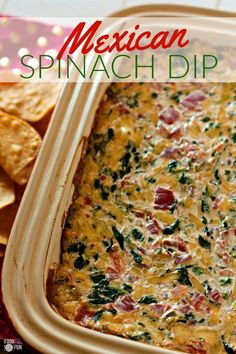 mexican spinach dip in a casserole dish with tortilla chips on the side