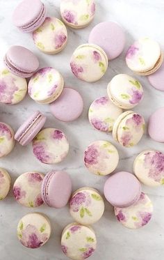 pink and white macaroons on a marble surface