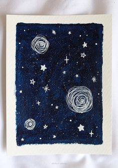 an art print with stars and the moon in space, on a white sheeted surface