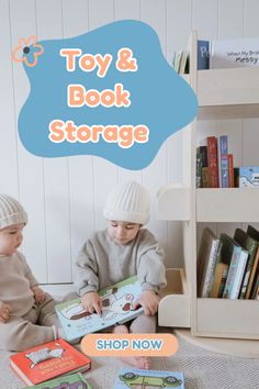 two young children sitting on the floor playing with toys and books in front of them