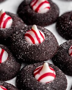 chocolate cookies with white and red candy on top