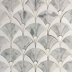 an art deco wallpaper with white and grey marble tiles in the shape of fish scales