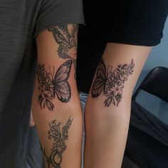 two people with butterfly tattoos on their arms