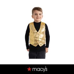 a young boy wearing a gold vest and black shirt with the words macy's on it