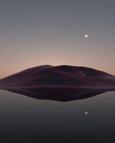 the moon shines brightly in the sky over a body of water with sand dunes