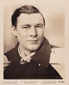 an old black and white photo of a man wearing a uniform with a bow tie