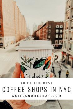 someone holding up a cup of coffee in their hand with the words, 10 of the best coffee shops in nyc