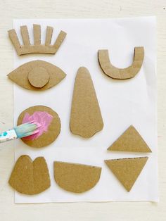 cardboard cut out shapes with a paintbrush