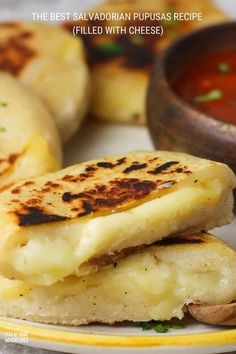 two pieces of bread on a plate with sauce