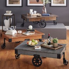 a living room with two tables and pictures on the wall