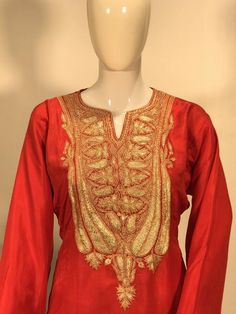 A stunningly fabulous outfit, featuring Kashmiri Tilla Embroidery. - - - - - - - - - - - - - - - - - - - - Product Details- Condition: Brand New- Colour: Red- Embroidery: PUff Tilla- Embroidery Color: GoldF A B R I CShirt: Pure SilkDupatta: Pure GeorgetteLower: Pure SilkF I N I S HUnstitched/Semi-StitchedYou can get it stitched locally.47+ inches of Shirt Length and up to full sleeves length.StitchedWant something ready to wear? We can stitch it for you. Let us know the lining you require (cotto Red Raw Silk Anarkali Set For Eid, Red Silk Churidar For Transitional Season, Red Anarkali Style Raw Silk Churidar, Transitional Red Silk Churidar, Red Raw Silk Kurta With Traditional Drape, Red Resham Embroidered Kurta For Transitional Season, Red Kurta With Resham Embroidery For Transitional Season, Designer Red Kurta With Pallu, Transitional Red Raw Silk Kurta