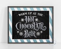 a black and white sign that says warm up at the hot chocolate bar with snowflakes on it