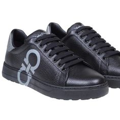 Salvatore Ferragamo Gancini-Logo Printed Lace-Up Sneakers Men's Black 12 $660. Dimensions: Heel: 1cm 100% Leather Made In Italy Designer Model Number: Numbernero Designer Colour: Black New Season Fw22 Calfskin Sneakers Black Colour Grained Leather Finish Gancini Logo On The Side Model With Round Tip Contrasting Heel Closure With Laces Leather Interior Rubber Sole Calfskin Composition Made In Italy Made In: Italy Custom Calf Leather Sneakers With Embossed Logo, Luxury Black Sneakers With Embossed Logo, Luxury Black Sneakers With Rubber Sole, Custom Leather Sneakers With Embossed Logo And Round Toe, Luxury Calf Leather Sneakers For Formal Occasions, Luxury Sneakers With Leather Sole And Plain Toe, Luxury Low-top Custom Sneakers For Formal Occasions, Luxury Wingtip Calf Leather Sneakers, Designer Calf Leather Sneakers With Textured Sole