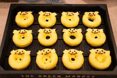 doughnuts shaped like pikachu faces are in a black box on the table