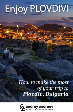 an image of people sitting on rocks in front of a city at night with the words,