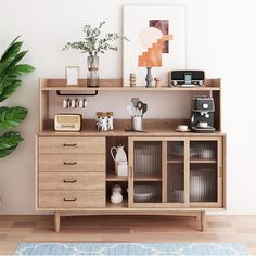 a wooden shelf filled with lots of different types of items next to a potted plant