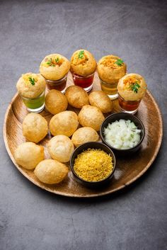 a wooden plate topped with different types of food