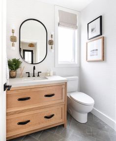 the bathroom is clean and ready for us to use it's natural wood accents