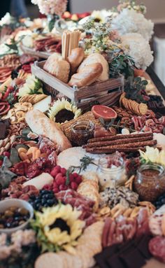 a table topped with lots of different types of food and desserts next to each other