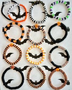 halloween bracelets with bats and beads on them