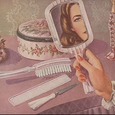 a woman is looking at her reflection in the mirror while she brushes her nails with scissors and combs