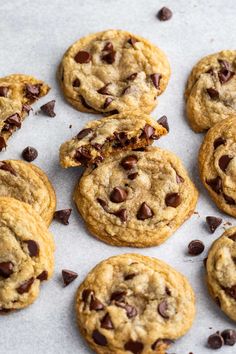 several chocolate chip cookies on a baking sheet