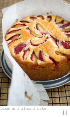 a plum and almond cake on a cooling rack