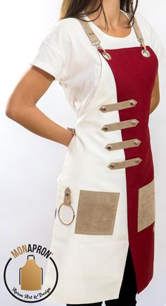 a woman wearing an apron with straps and buttons on the front, standing in front of a white background