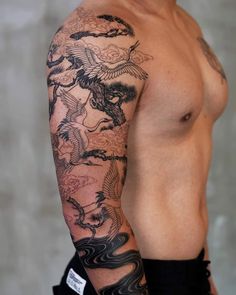 a man with a dragon tattoo on his arm