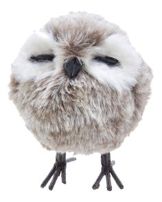 a stuffed owl with its eyes closed