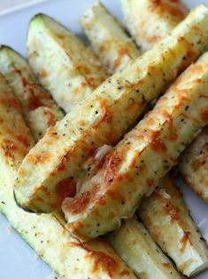 parmesan crusted zucchini spears on a white plate