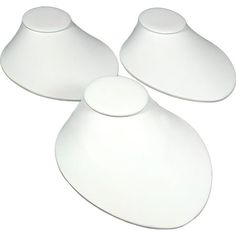 three white plates sitting on top of each other