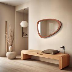 a wooden bench sitting in front of a mirror on the wall next to a vase