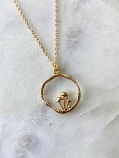 Orders purchased after 7/25/22 will be shipped on 8/12/22. ---------------------------------------------------------------- Dress up your outfit with this dainty mushroom pendant necklace! The necklace chain is 16K Gold plated over brass, and the pendant is made of alloy metal.