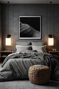 a large bed sitting in a bedroom next to two lamps and a painting on the wall