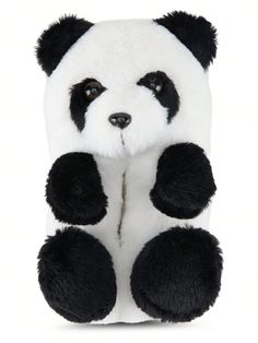 a stuffed panda bear with black and white fur on it's back, sitting in front of a white background