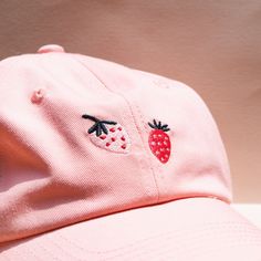 Look chic in our LARK Strawberry hat 🍓 Light pink with embroidered strawberries. Cute Hats With Embroidered Logo And Curved Brim, Cute Baseball Cap With Embroidered Logo And Curved Brim, Pink Cotton Hat With Embroidered Logo, Trendy Pink Brimmed Hat, Trendy Brimmed Hat With Embroidered Logo, Pink Embroidered Logo Baseball Cap, Trendy Pink Dad Hat With Embroidered Logo, Cute Baseball Cap With Embroidered Logo, Pink Dad Hat For Summer