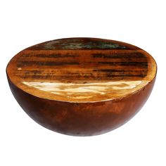 a wooden bowl sitting on top of a white table