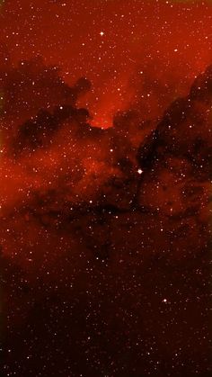 the night sky is filled with stars and bright red clouds, as seen from space