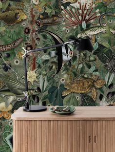 a wallpaper with tropical plants and animals on it