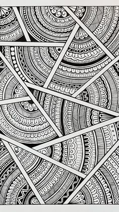 an intricate black and white drawing with lines in the center, surrounded by smaller circles