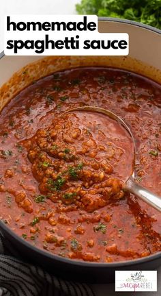 homemade spaghetti sauce in a pot with a ladle