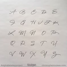 the letters and numbers are written in cursive writing with black ink on white paper