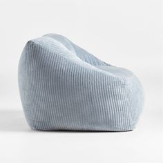 a blue bean bag sitting on top of a white floor